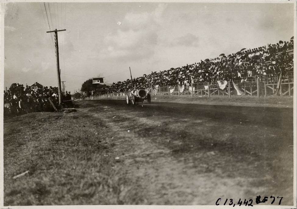 Driver and passenger in racecar, 1908 Grand Prize races