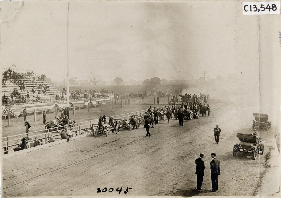 Racecars lined up on track, 1908 Grand Prize races