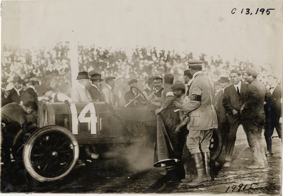 Louis Wagner in Fiat racecar after finish, 1908 Grand Prize races