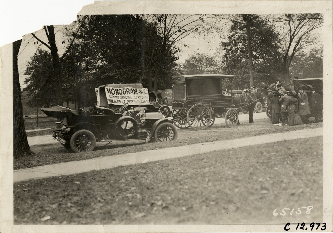 Horse-drawn wagons and automobile, 1910 Fairmount Park races