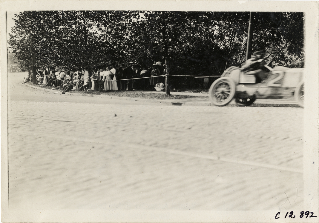 Driver and passenger in racecar, 1909 Fairmount Park races