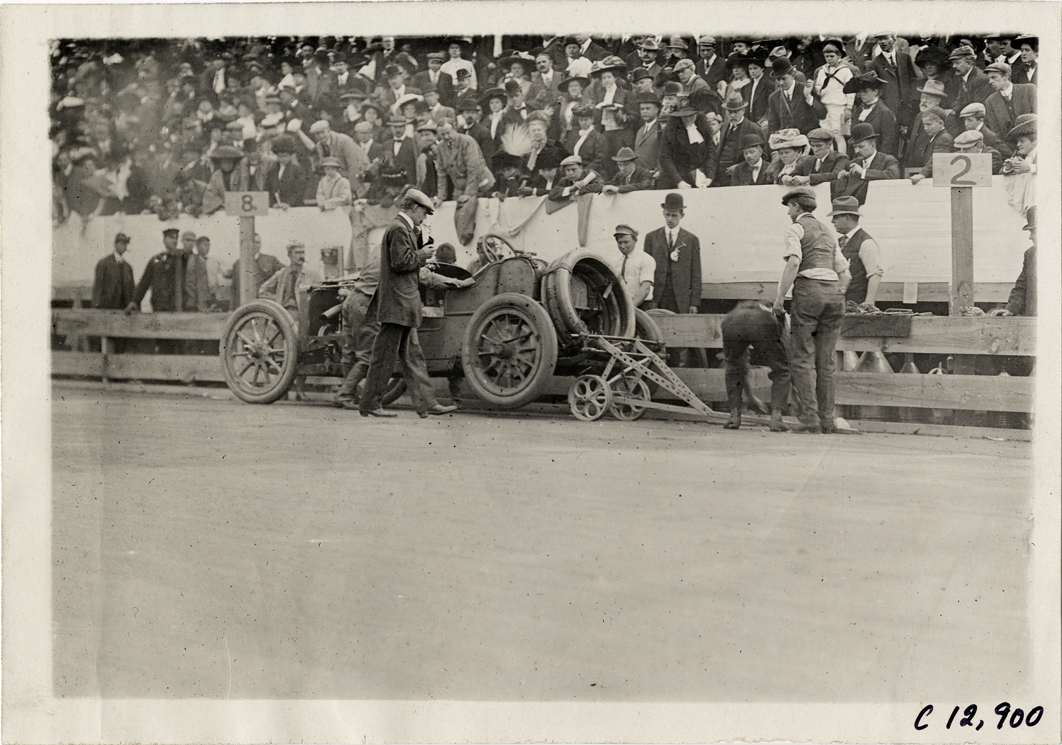 Pit crew working on racecar, 1909 Fairmount Park races