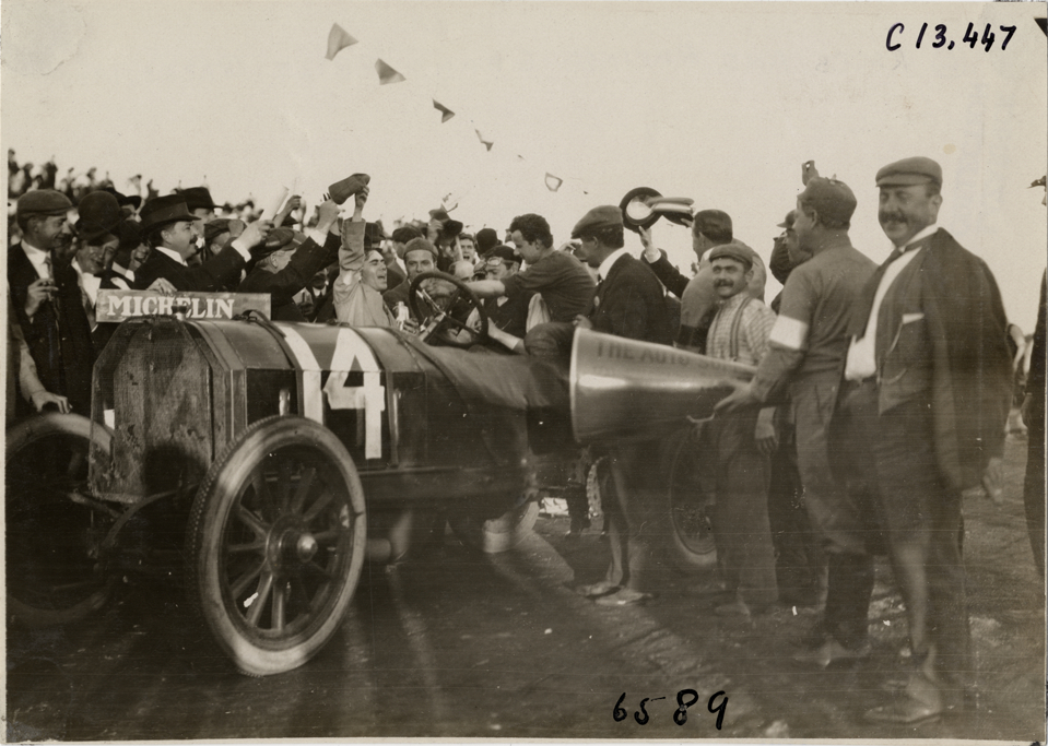 Louis Wagner in Fiat racecar after finish, 1908 Grand Prize races