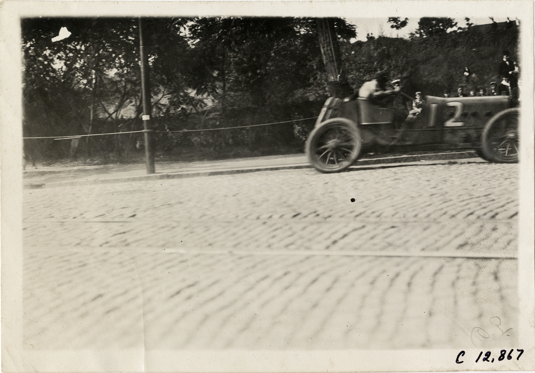 Driver and passenger in racecar, 1909 Fairmount Park races