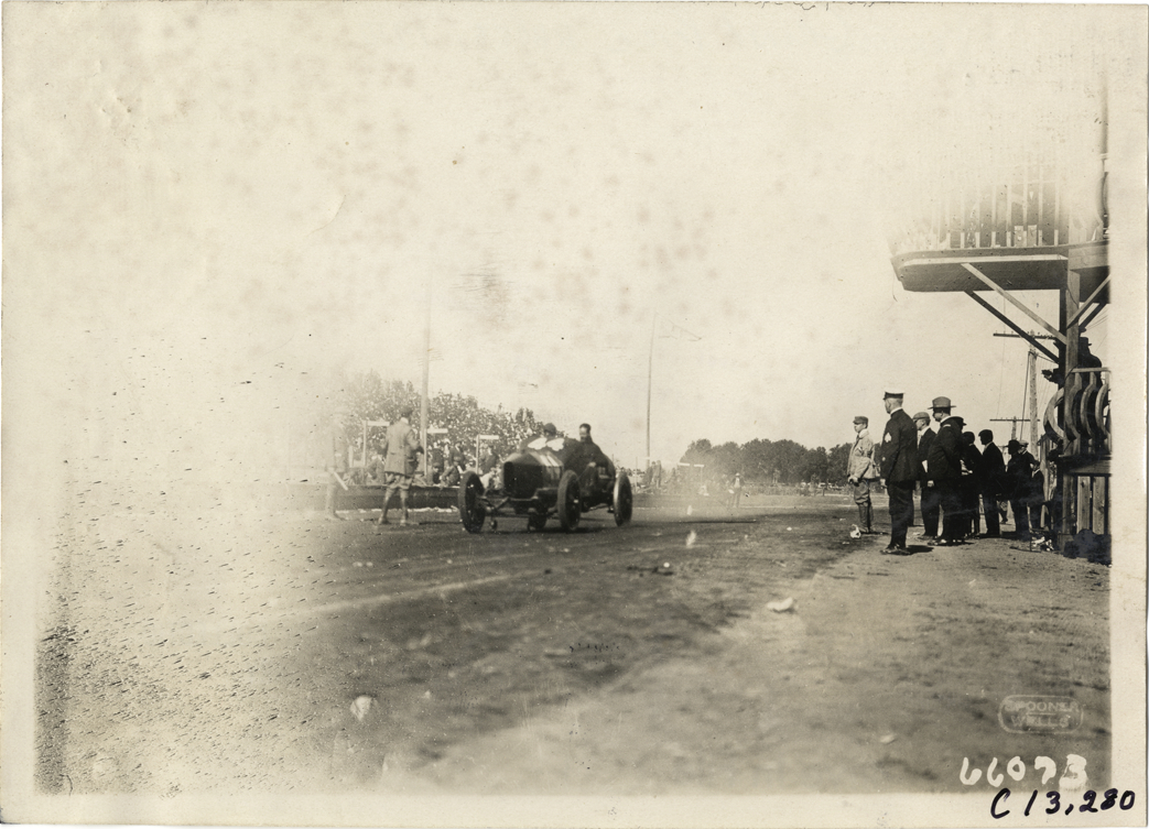 Racecar passing judges' stand, 1910 Grand Prize races