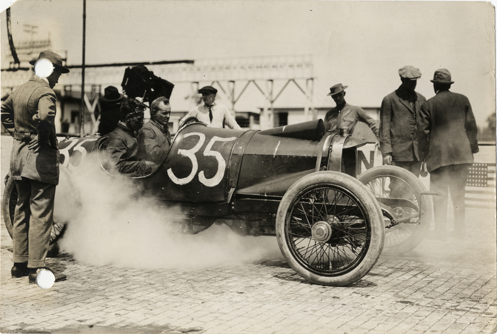 Willie Haupt and passenger in Mason racecar, 1913 Indianapolis 500 automobile race