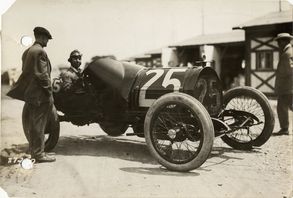 George Clark posing in Tulsa racecar, 1913 Indianapolis 500 automobile race