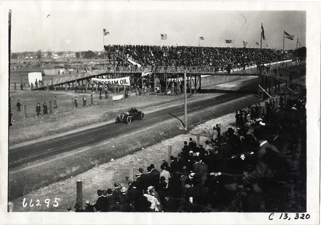 Driver and passenger in racecar, 1910 Grand Prize races