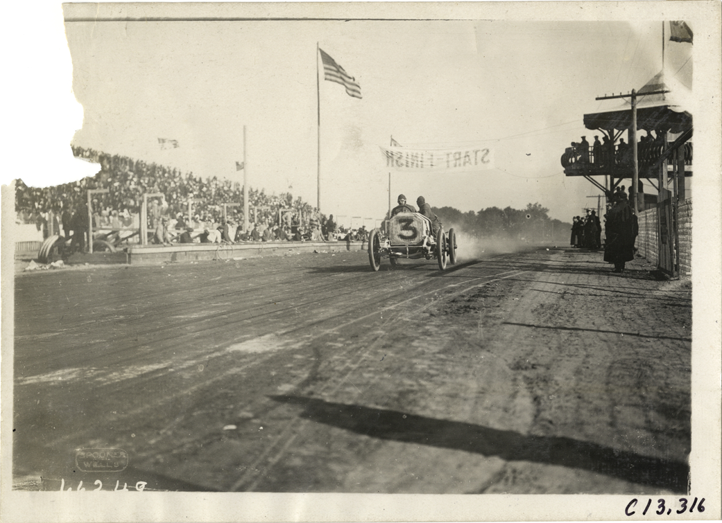 Driver and passenger in racecar, 1910 Grand Prize races