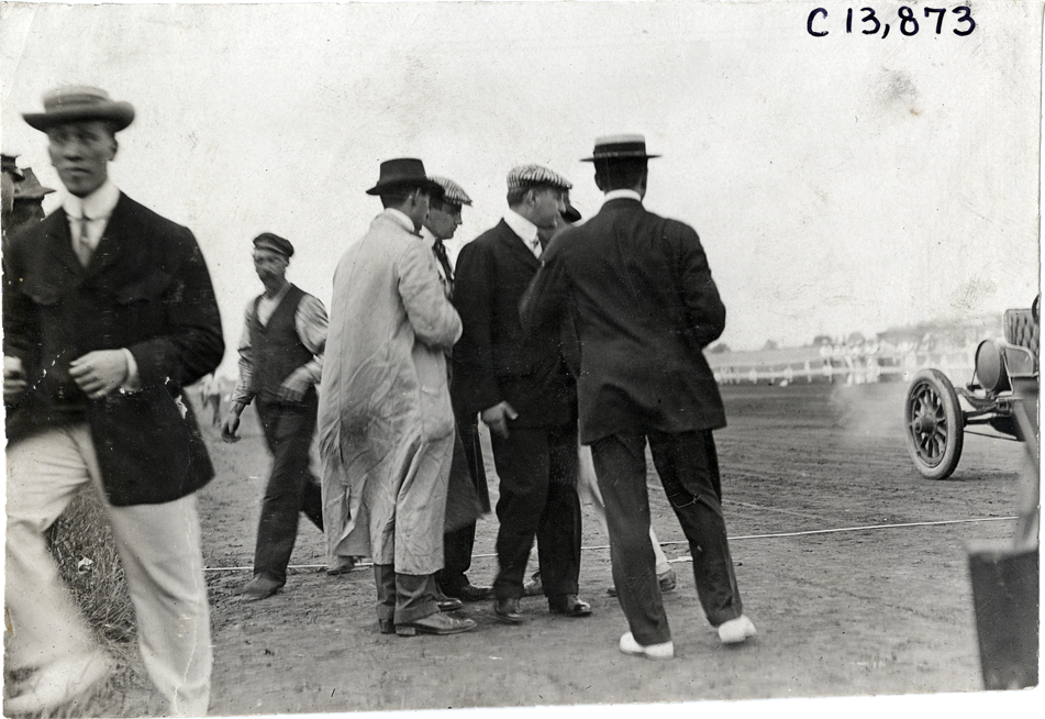 Men standing on side of track, 1908 Long Branch races