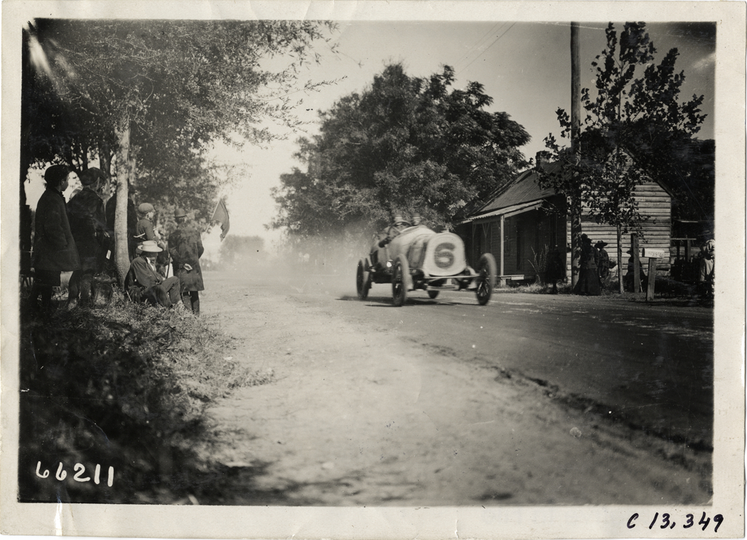 Driver and passenger in racecar, 1910 Grand Prize races