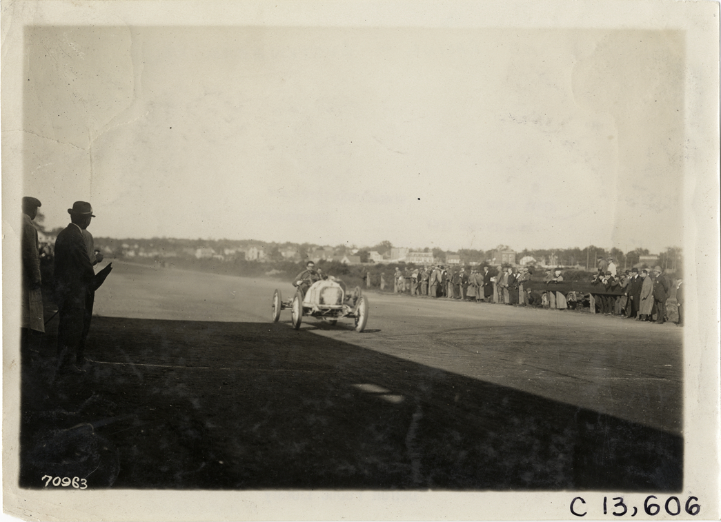 Driver in racecar, 1911 Guttenberg races