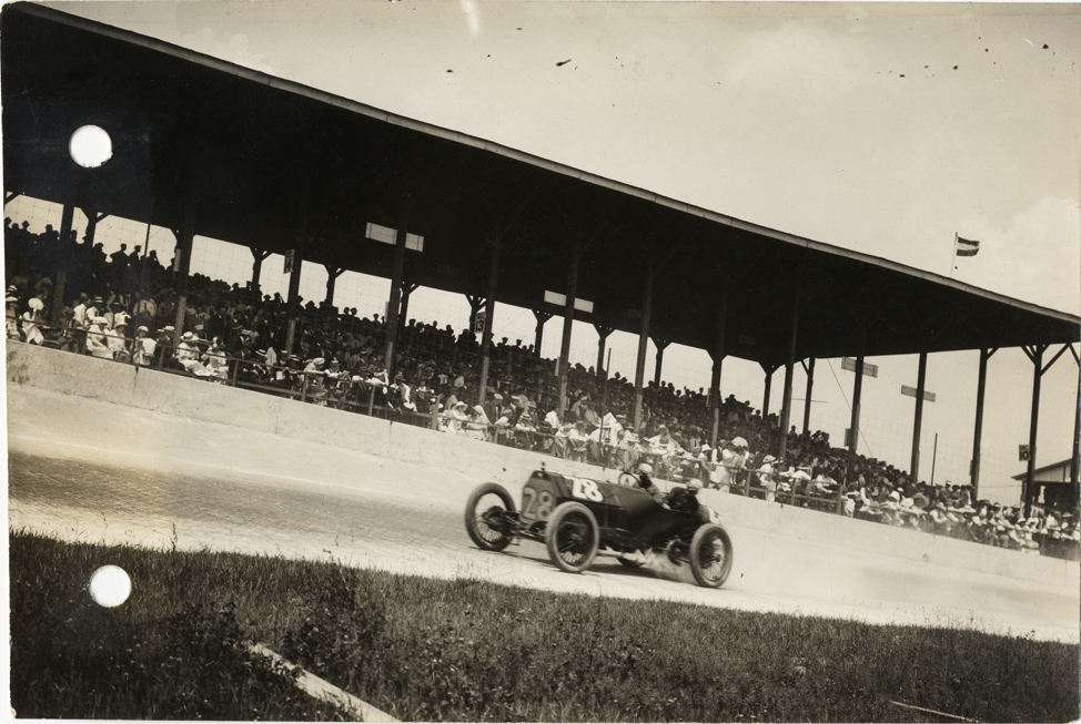 Vincenzo Trucco and passenger in racecar, 1913 Indianapolis 500 automobile race