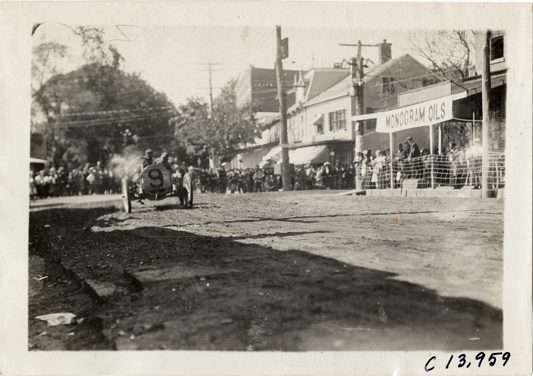 Driver and passenger in racecar, 1909 Long Island Derby