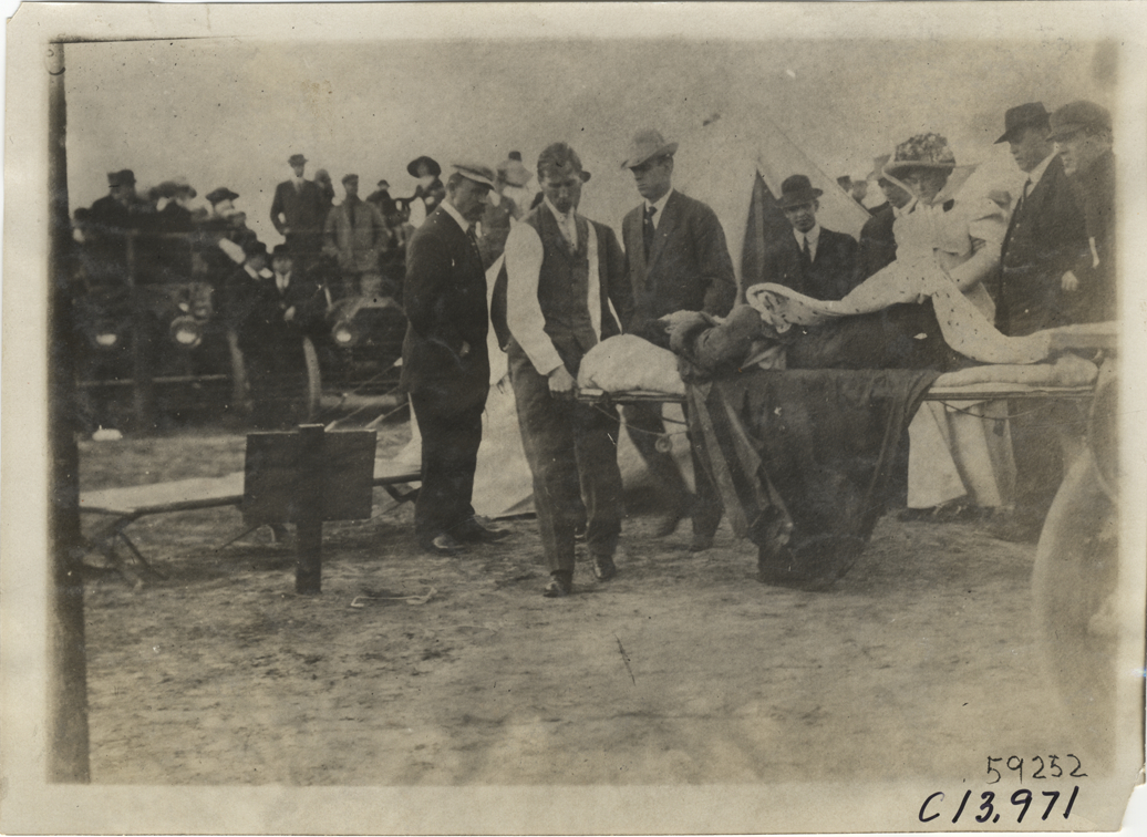Man on stretcher, 1910 Los Angeles races
