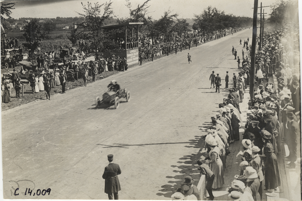 Driver and passenger in racecar, 1908 Lowell road race