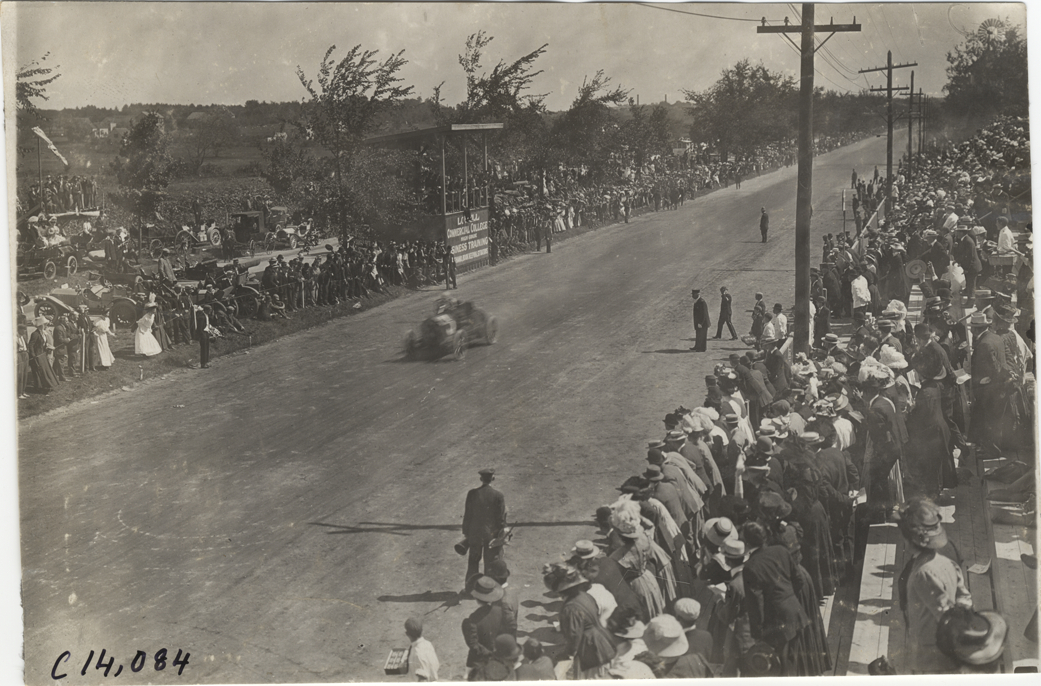Driver and passenger in racecar, 1908 Lowell road race