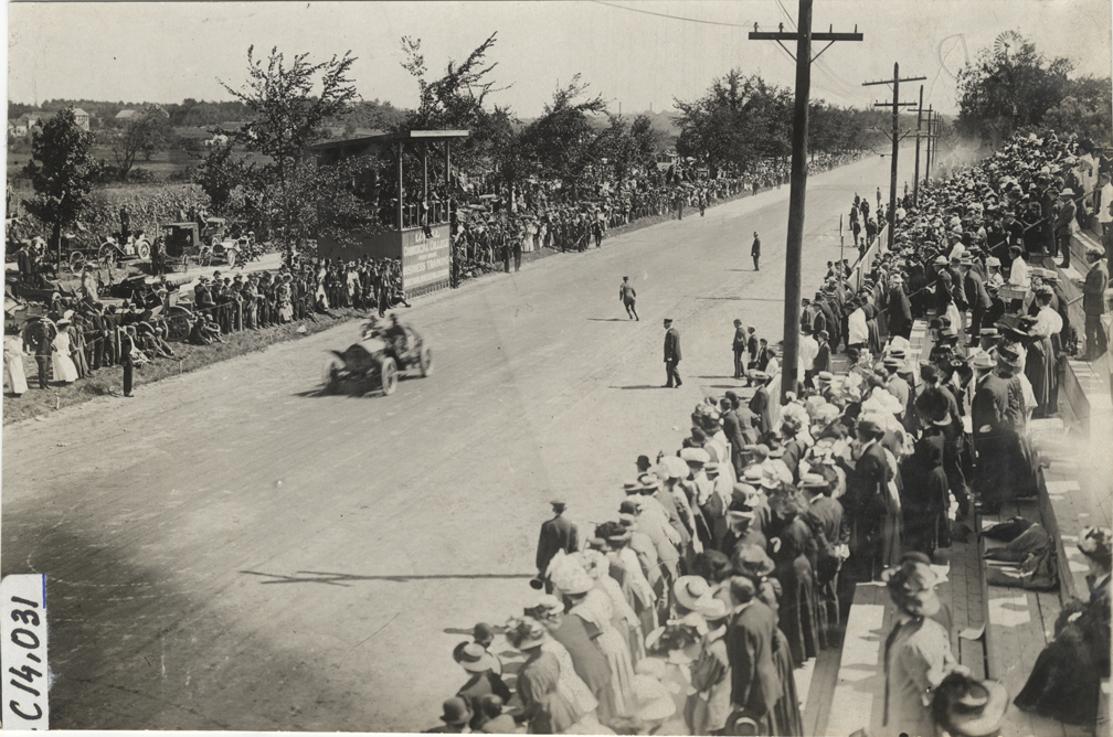 Driver and passenger in racecar, 1908 Lowell road race