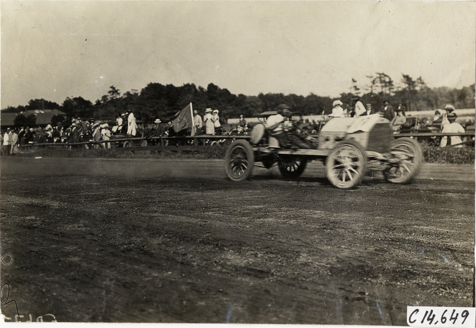 Driver in racecar, 1909 Readville races