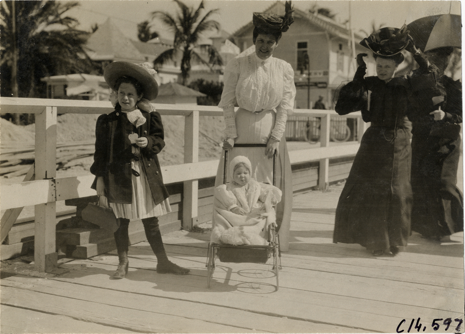 Woman pushing child in stroller, 1906 Ormond-Daytona races