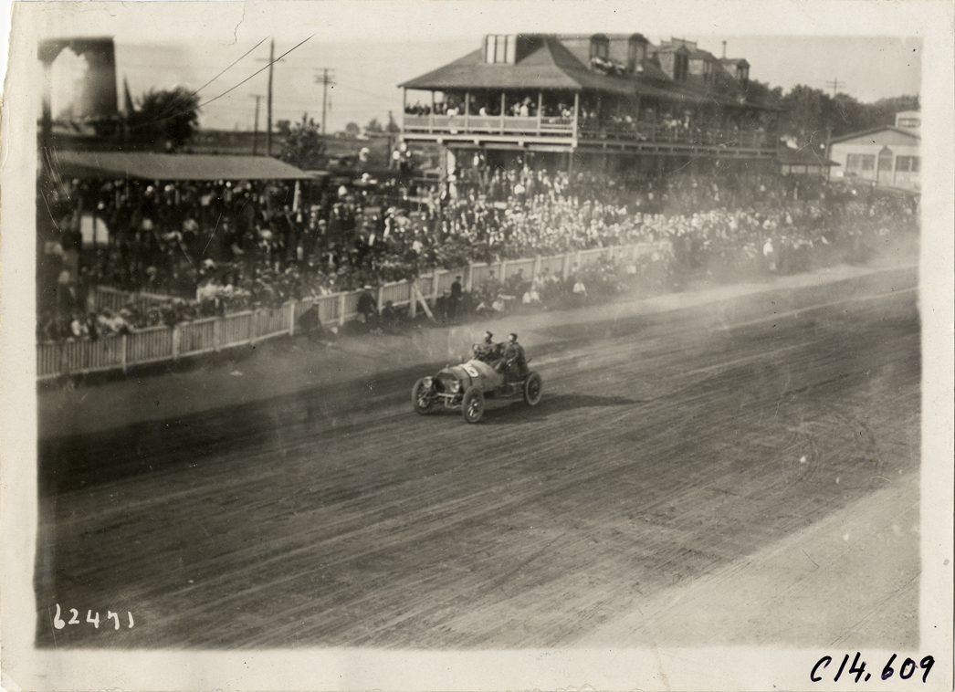 Charles Howard driving Chalmers racecar, 1910 Point Breeze races