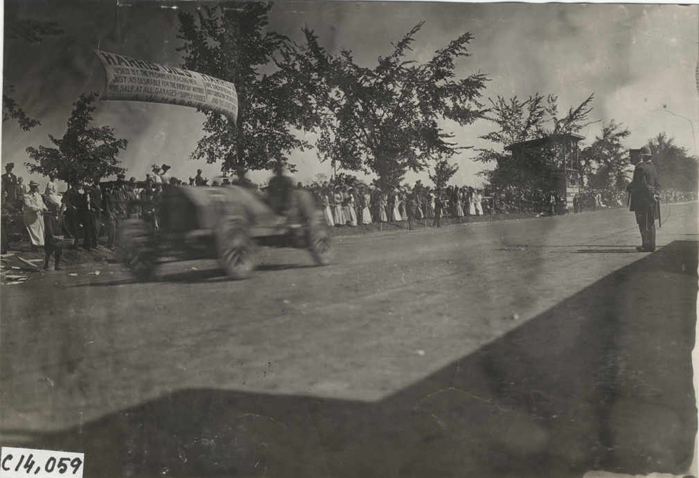 Driver and passenger in racecar, 1908 Lowell road race
