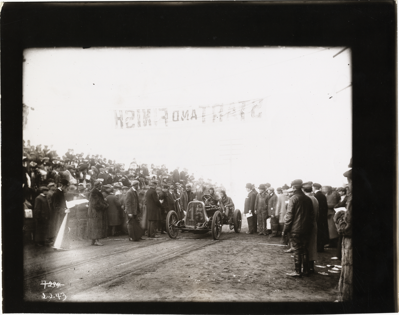 Driver and passenger in racecar, 1906 Vanderbilt Cup races