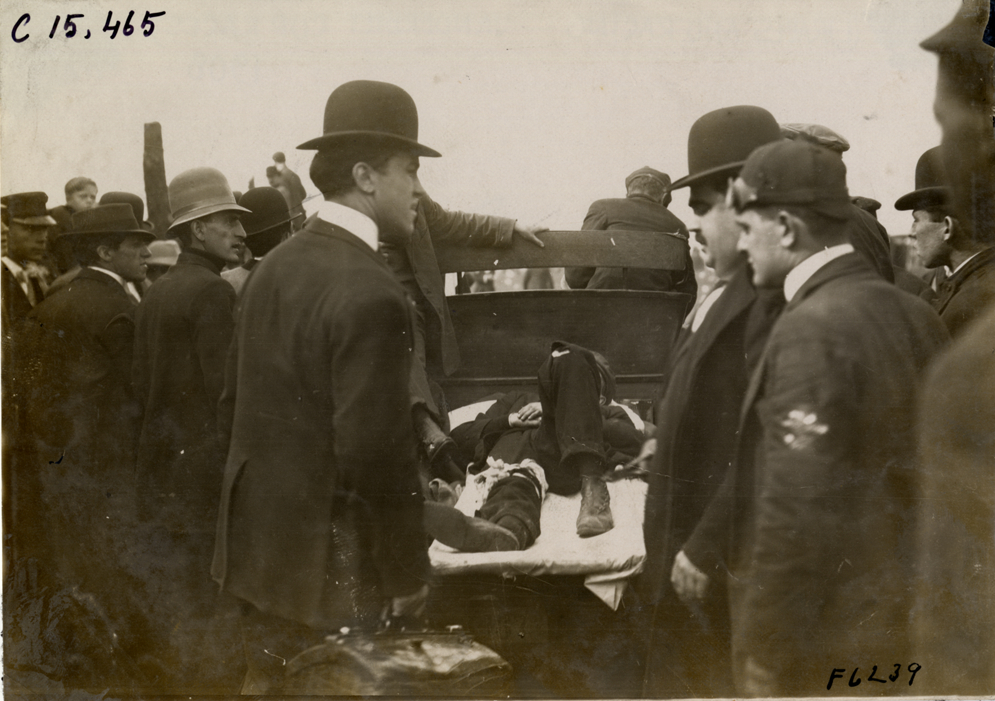 Truck transporting injured man, 1908 Vanderbilt Cup races
