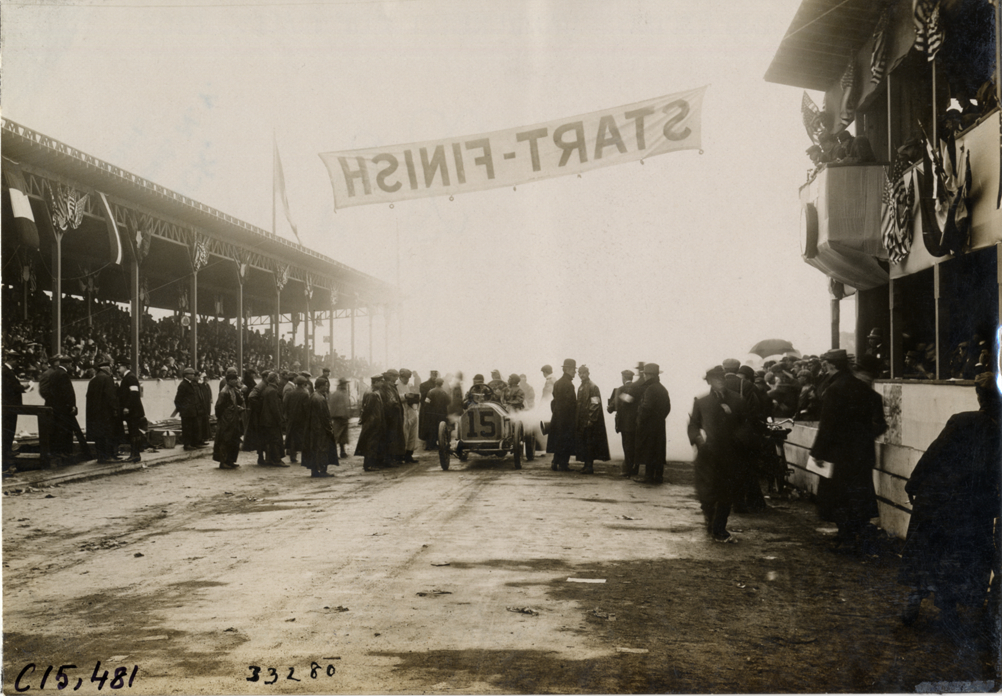 Officials and racecar at starting line, 1908 Vanderbilt Cup races