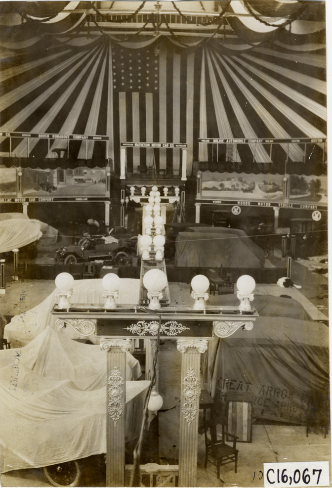 Automobiles in exhibit area during installation, 1909 Atlanta Auto Show