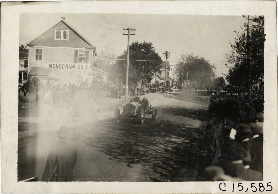 Driver and passenger in racecar, 1909 Vanderbilt Cup races