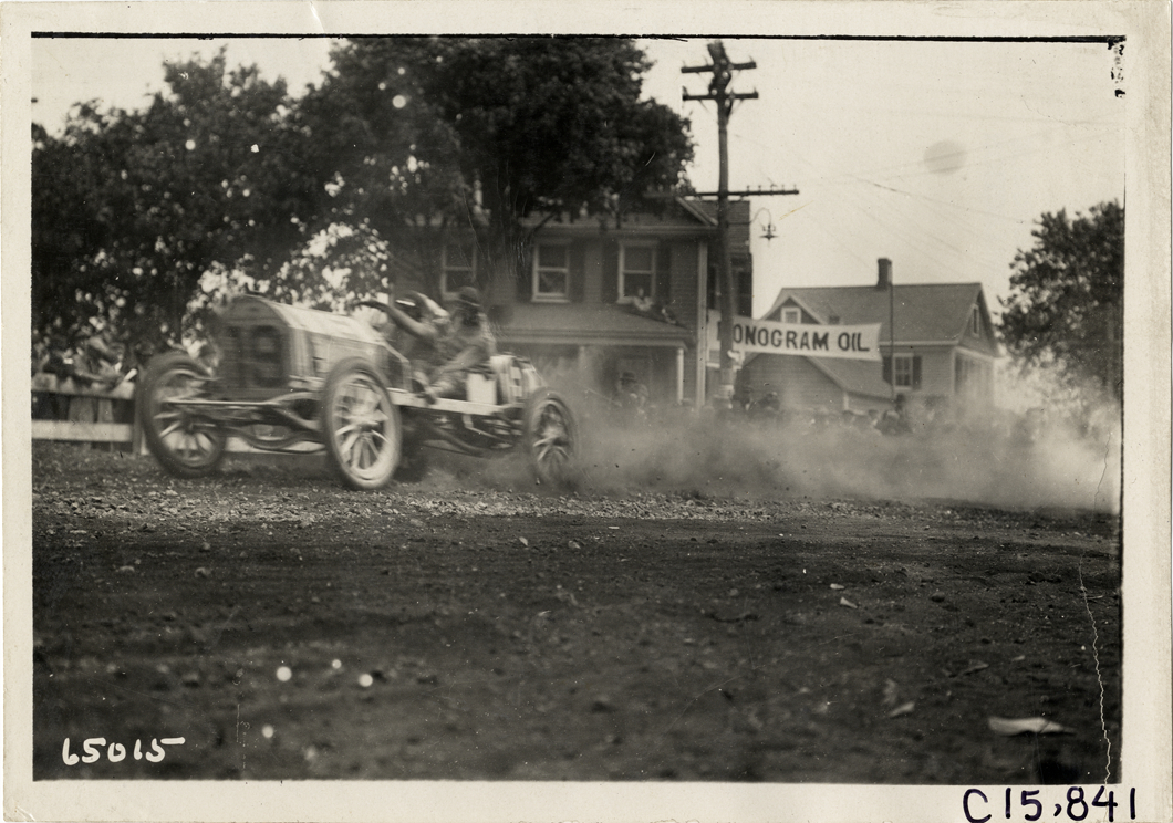 Driver and passenger in racecar, 1910 Vanderbilt Cup races