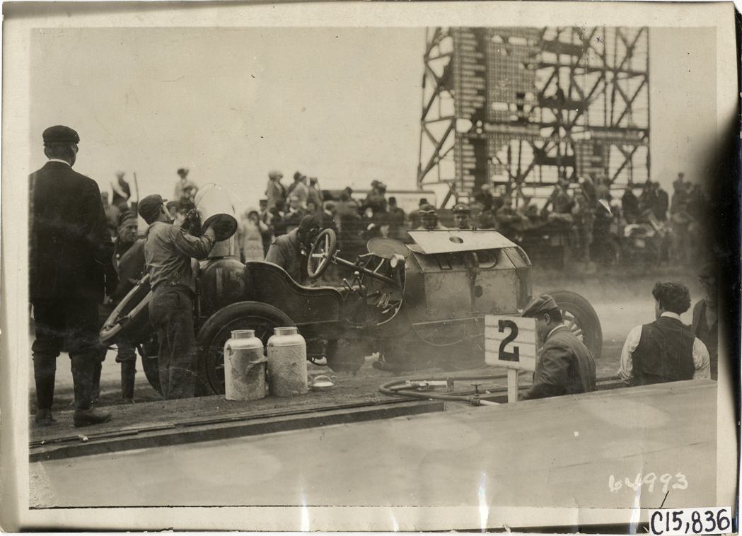 Pit crew working on racecar, 1910 Vanderbilt Cup races