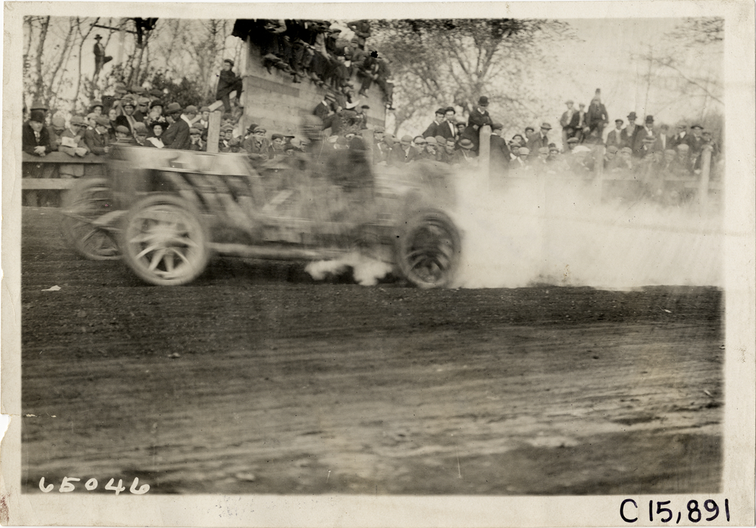 Driver and passenger in racecar, 1910 Vanderbilt Cup races