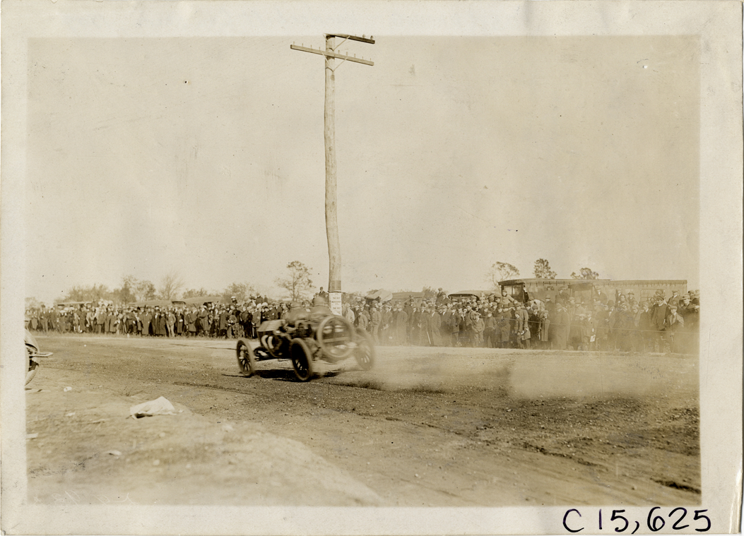 Driver and passenger in racecar, 1909 Vanderbilt Cup races