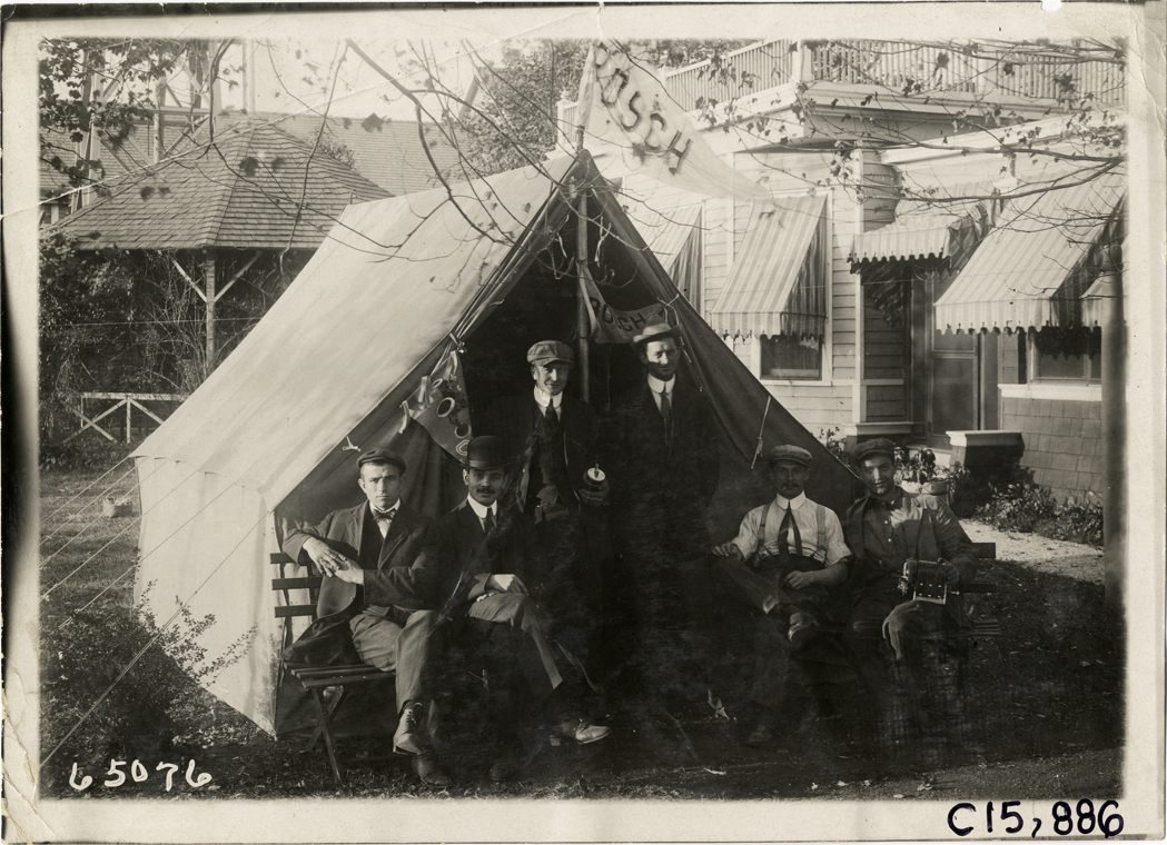 Men posing in front of Bosch tent, 1910 Vanderbilt Cup races
