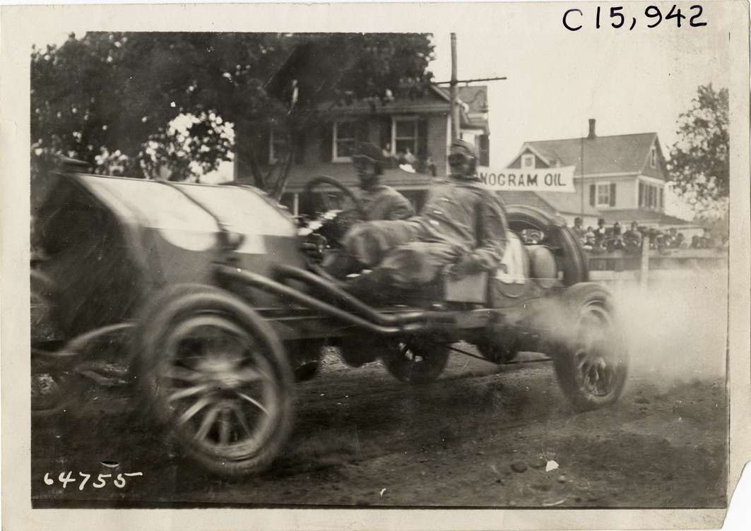Driver and passenger in racecar, 1910 Vanderbilt Cup races