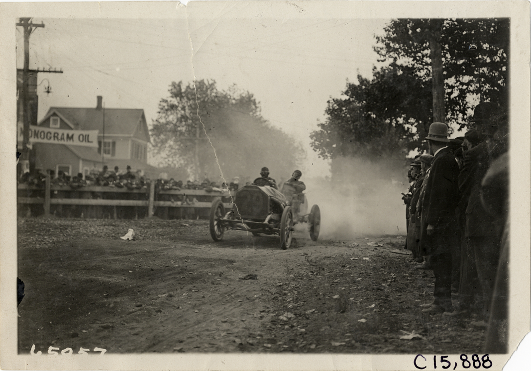 Driver and passenger in racecar, 1910 Vanderbilt Cup races