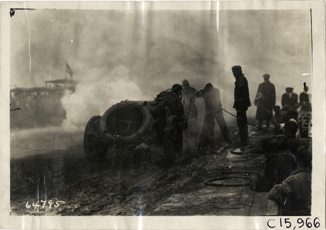 Pit crew working on racecar, 1910 Vanderbilt Cup races
