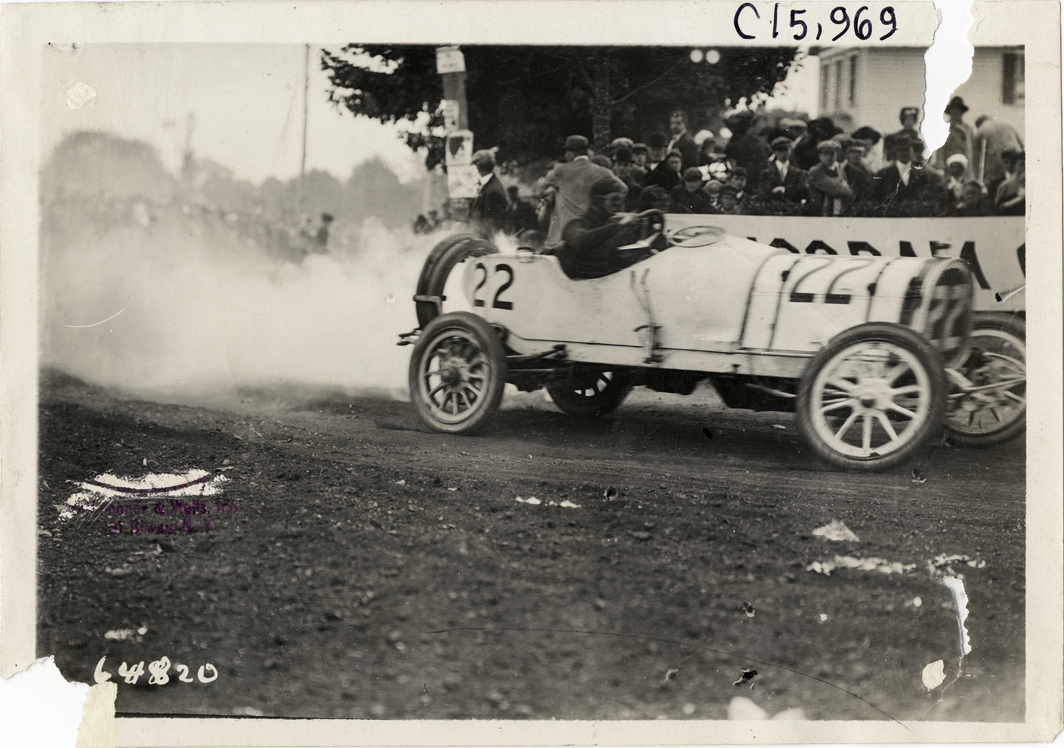 Driver and passenger in racecar, 1910 Vanderbilt Cup races