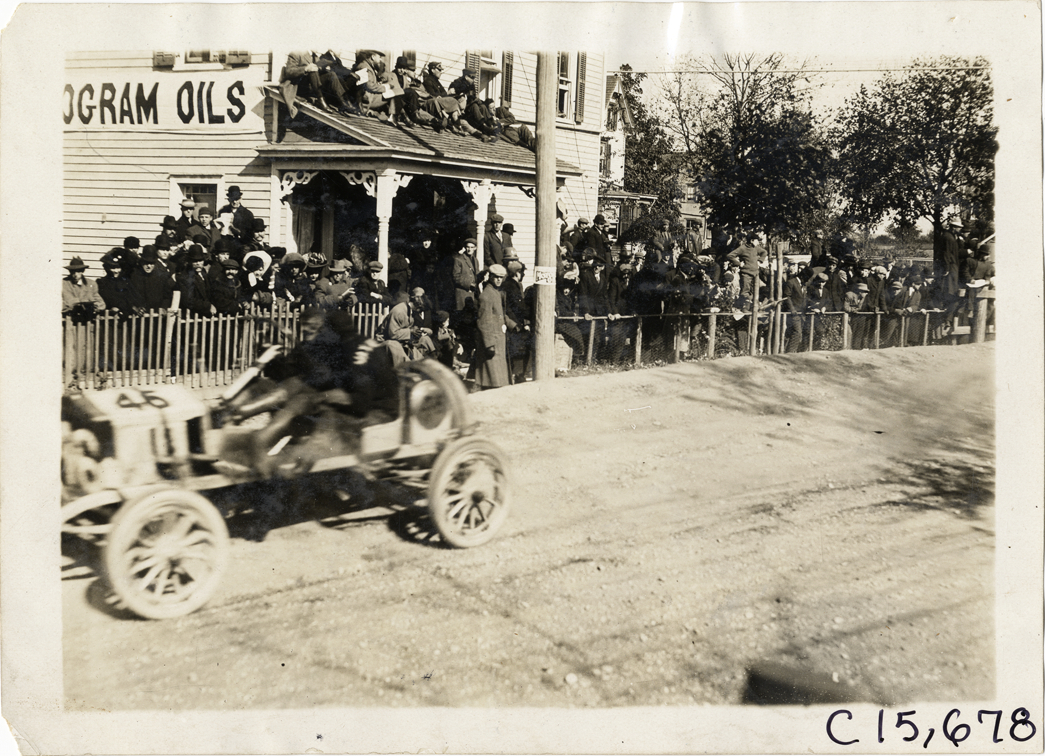 Driver and passenger in racecar, 1909 Vanderbilt Cup races