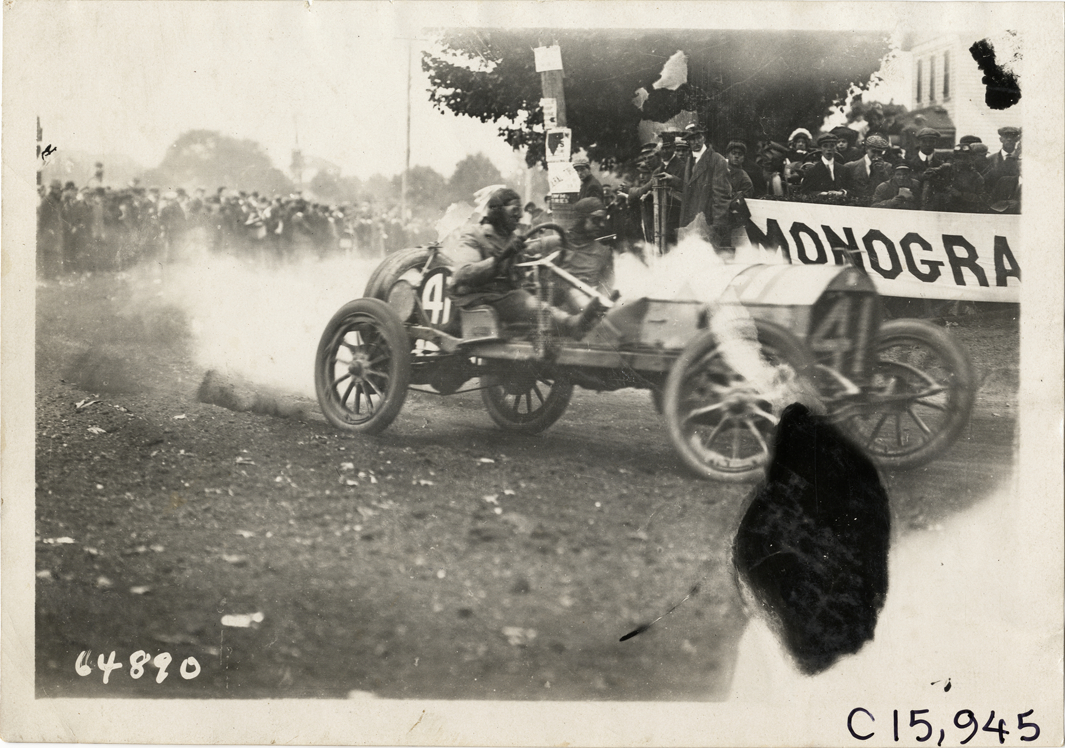 Driver and passenger in racecar, 1910 Vanderbilt Cup races