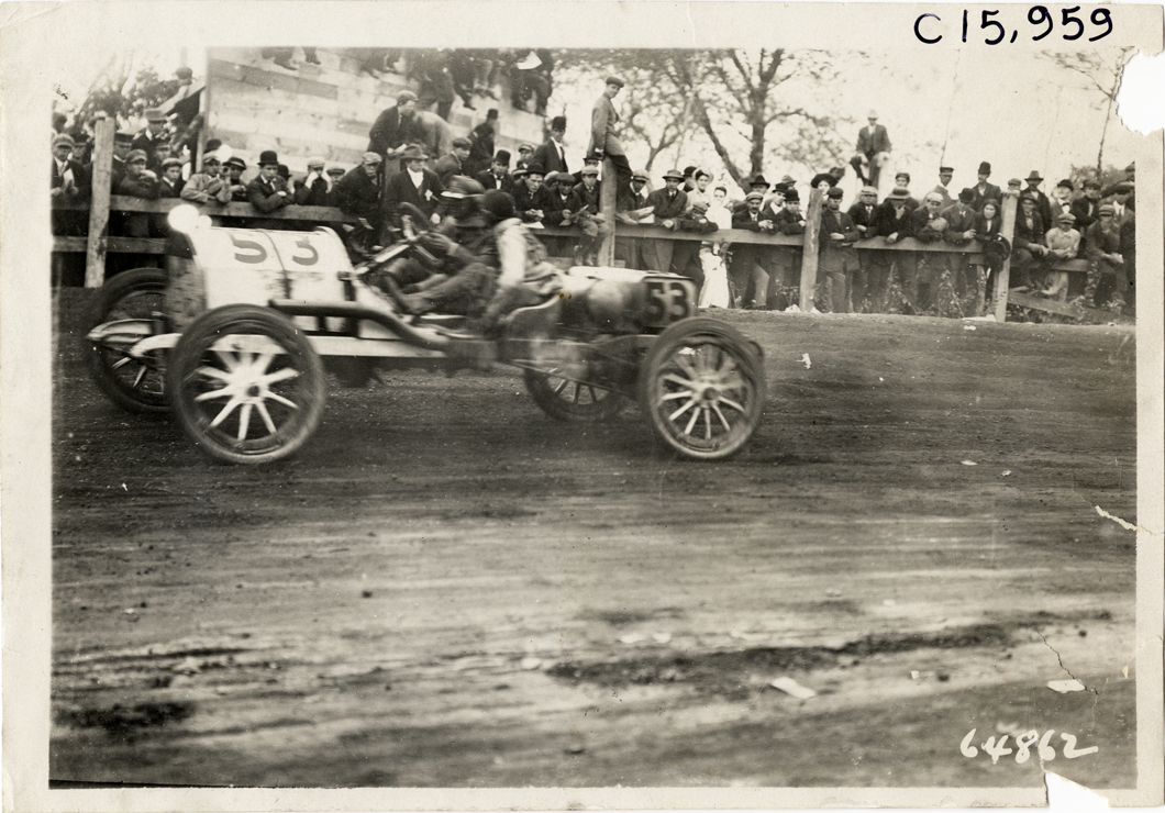 Driver and passenger in racecar, 1910 Vanderbilt Cup races