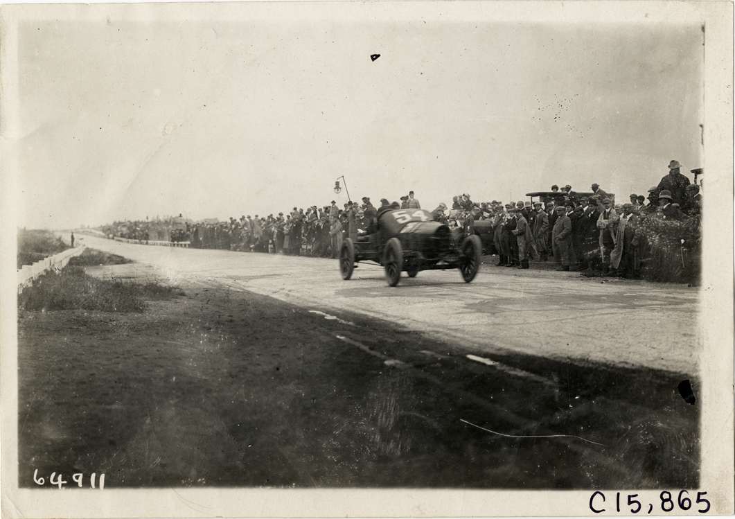 Driver and passenger in racecar, 1910 Vanderbilt Cup races