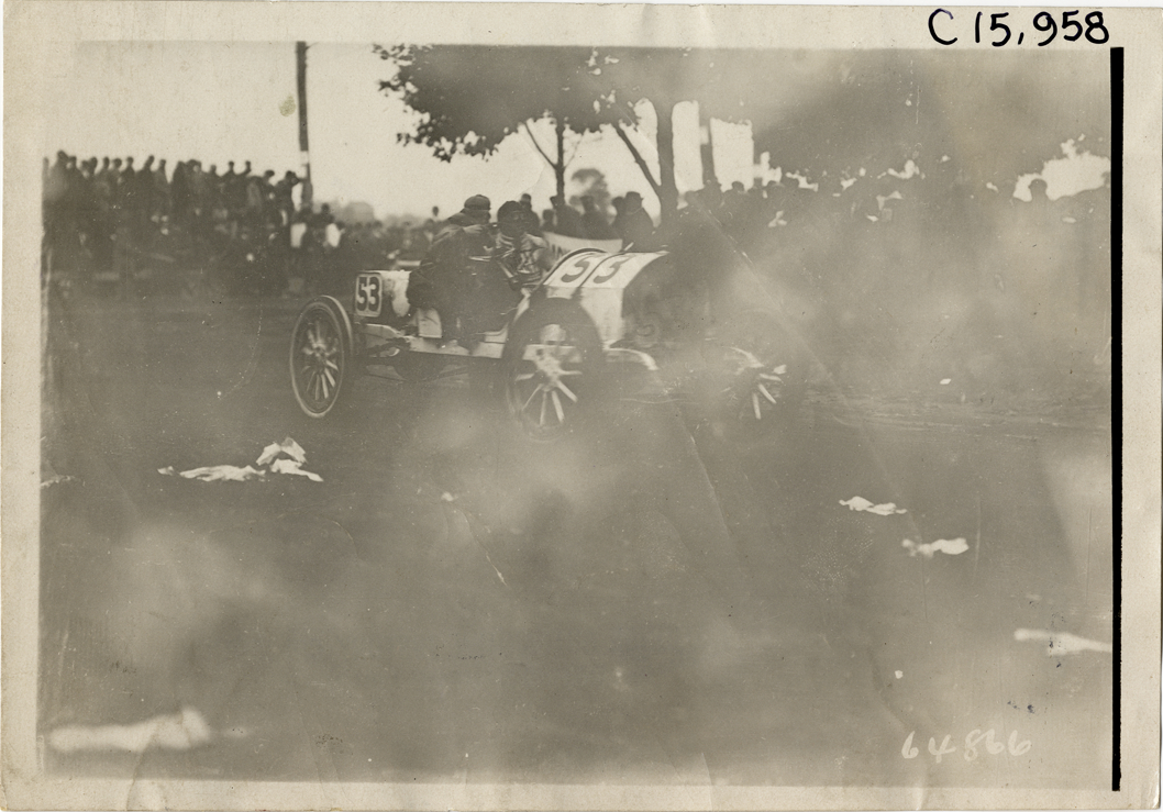 Driver and passenger in racecar, 1910 Vanderbilt Cup races