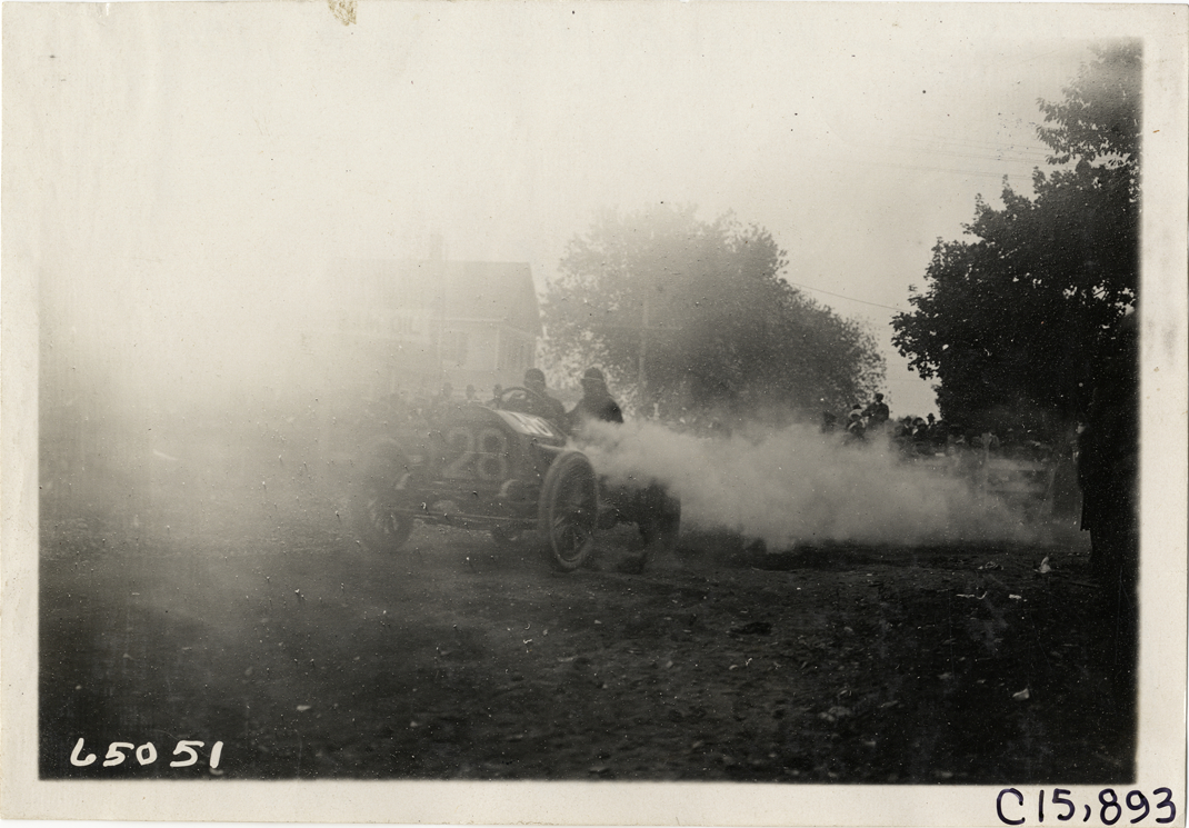 Driver and passenger in racecar, 1910 Vanderbilt Cup races