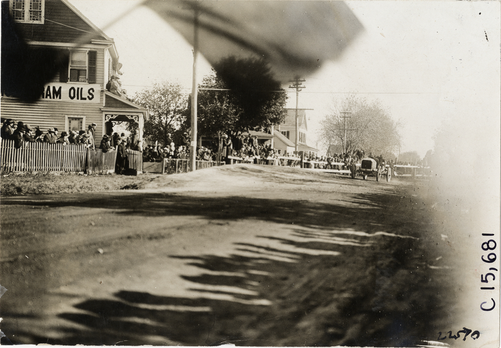 Driver and passenger in racecar, 1909 Vanderbilt Cup races