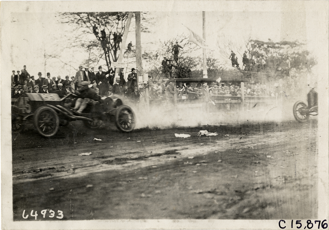 Driver and passenger in racecar, 1910 Vanderbilt Cup races
