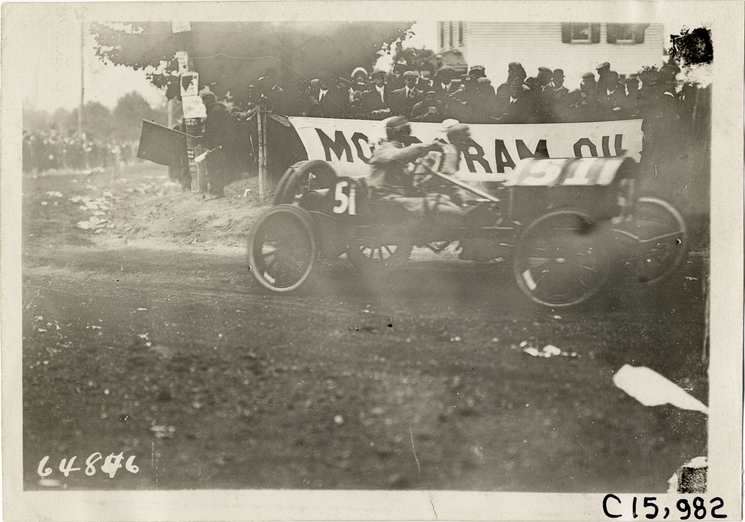 Driver and passenger in racecar, 1910 Vanderbilt Cup races