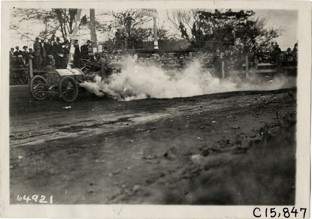 Driver and passenger in racecar, 1910 Vanderbilt Cup races